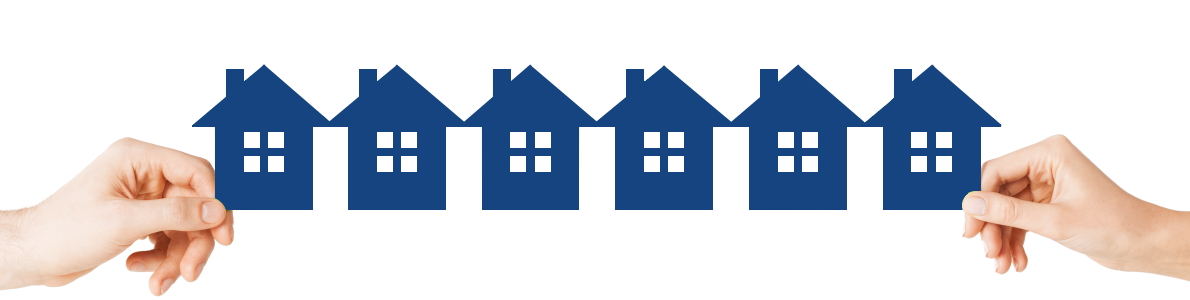 manos sujetando casas papel